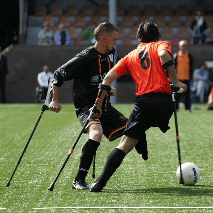 Two disabled athletes playing football