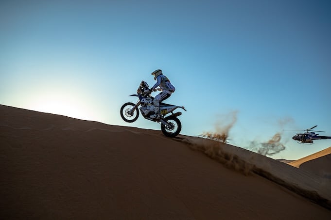 Motorbike rally-raid driver in the middle of the desert
